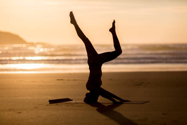 istock Woman doing meditation at sunset 889812134