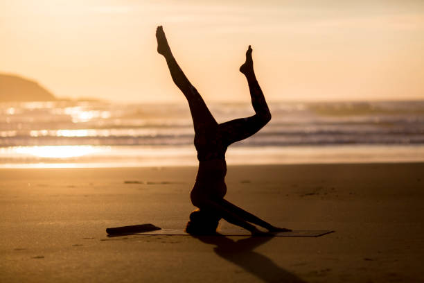 istock Woman doing meditation at sunset 889812154