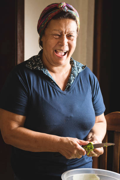 istock Woman preparing food and smiling 889843538