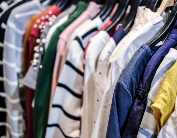 istock Close up clothes on hangers 889856904
