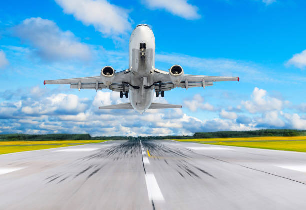 istock Passenger airplane fly up over take off runway from airport. 889857158