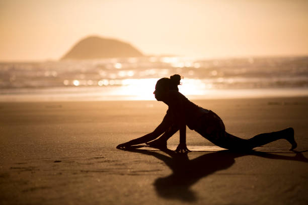 istock Woman doing meditation at sunset 889880368