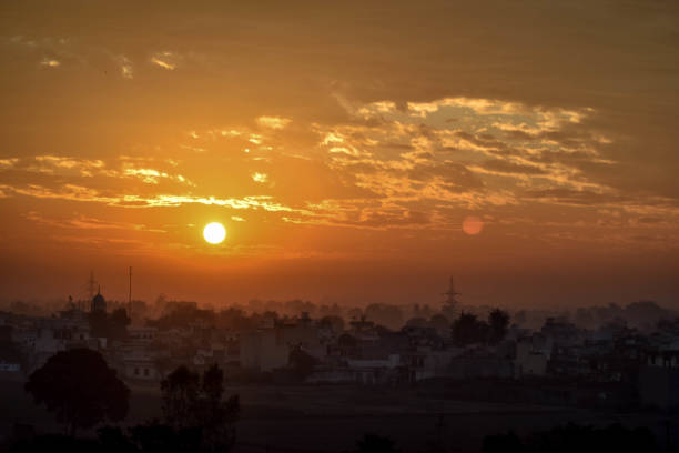 istock Sunrise over Village 889882554