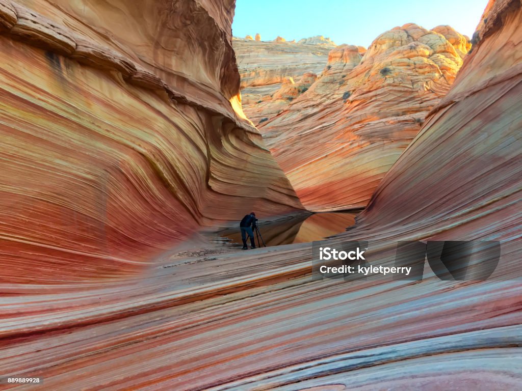 taking a photo at the wave A photographer sets up a picture at the wave, arizona, USA. Australia Stock Photo