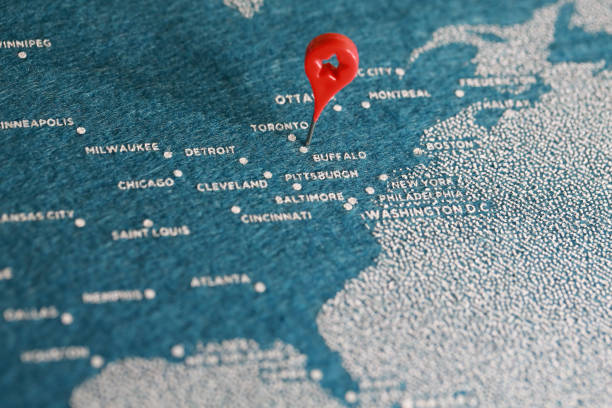 istock airplane fly on the blue felt painted map, north america 889892414
