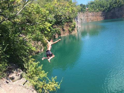 Man jumps off a cliff