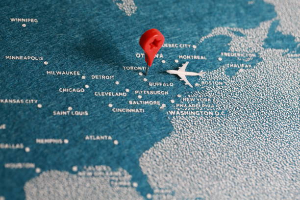 istock airplane fly on the blue felt painted map, north america 889894780