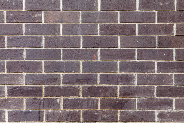 Dark Grayish Brown Brick Wall With Splashes & Minor Chips