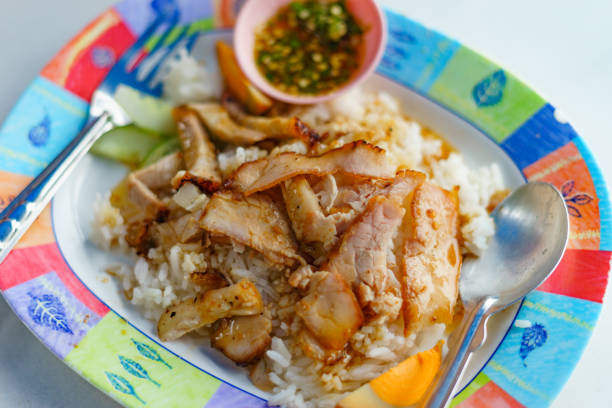 istock Barbecued red pork in sauce with rice 889908458