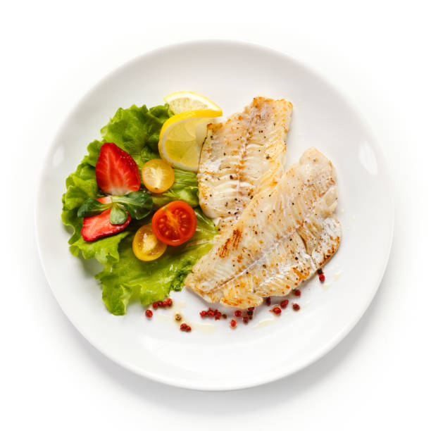 istock Fish dish - fried fish fillet and vegetables 889910824