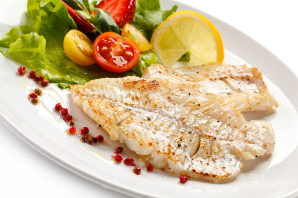 istock Fish dish - fried fish fillet and vegetables 889910868