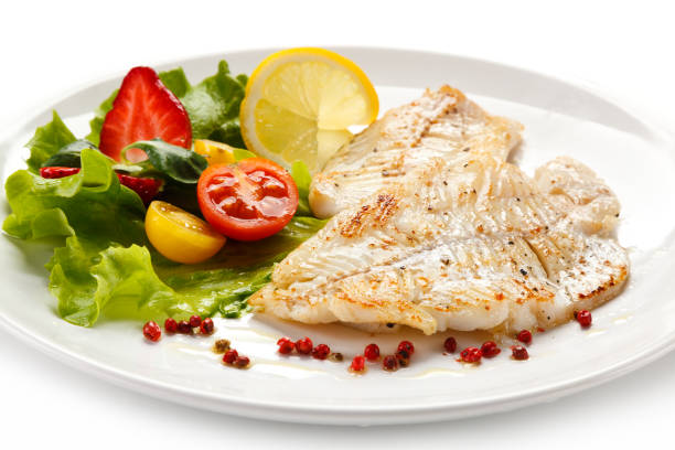 istock Fish dish - fried fish fillet and vegetables 889910892