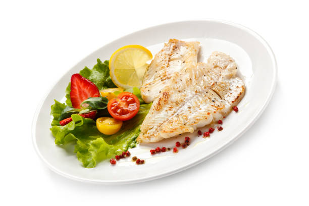 istock Fish dish - fried fish fillet and vegetables 889910908