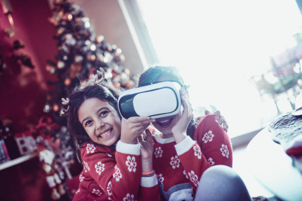 istock Two Little Sisters Playing and Fighting over Virtual Reality Simulator 889913236