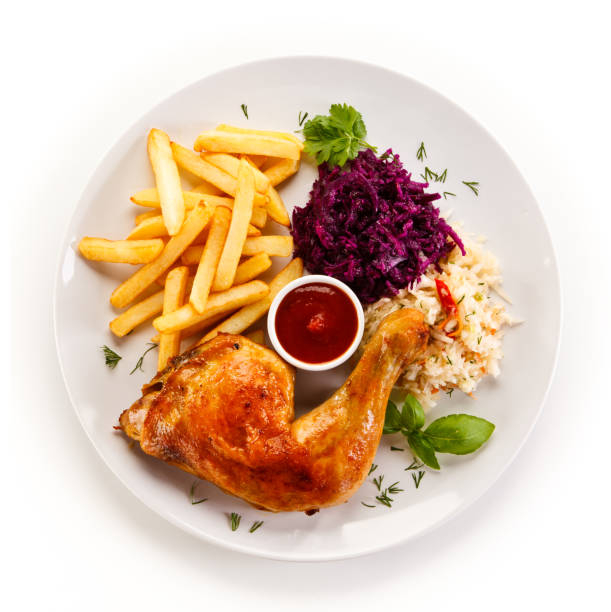 istock Grilled chicken legs with chips and vegetables 889919890