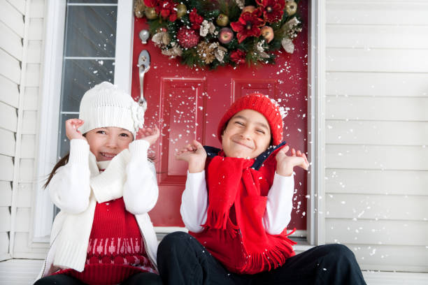 istock Young sibling celebrating Christmas 889922488