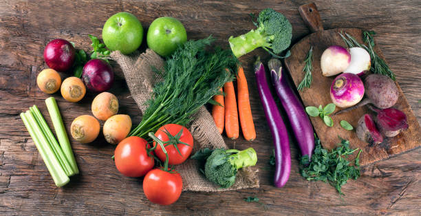 istock Fresh raw vegetables on wooden background 889935756