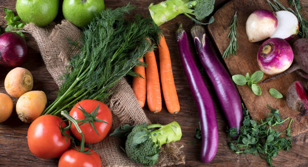 istock Fresh raw vegetables on wooden background 889935842