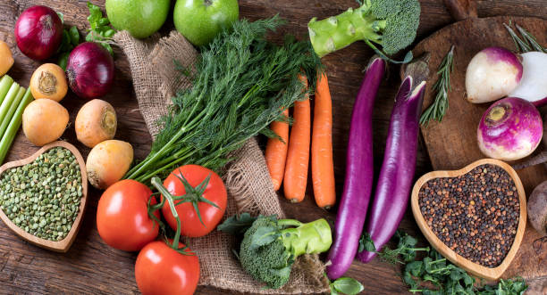istock Fresh raw vegetables on wooden background 889935870