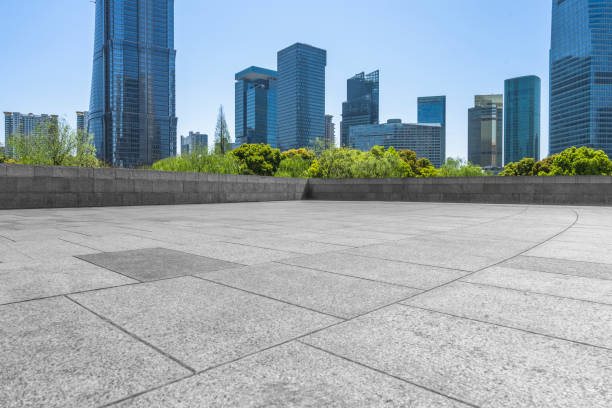 istock Empty brick floor with modern building in shanghai, china 889935984