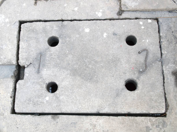istock Sewer manhole on the urban asphalt road 889956052