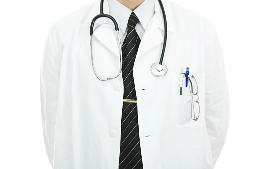 Close-up of unrecognizable Caucasian doctor, isolated on white background.