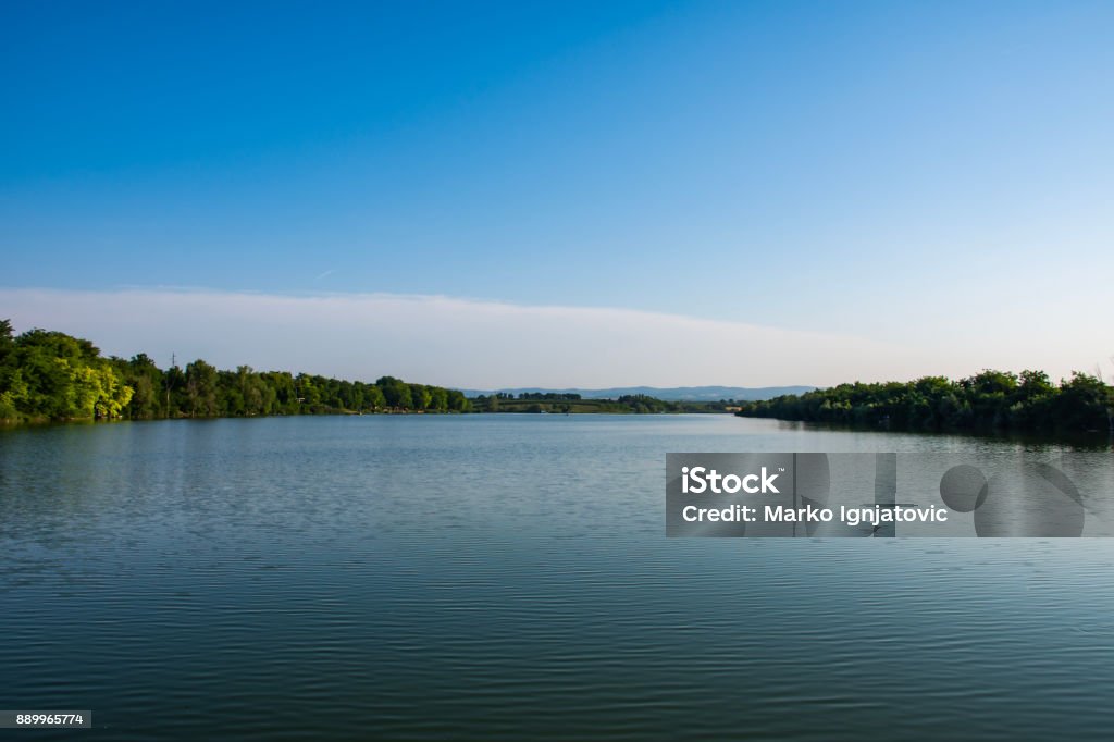 Beautiful clear lake, with very clean water, full of fish, a beautiful place for rest and fishing. Serbia / Ruma / Borkovac Lake View on the lake Borkovac, Ruma, Serbia Blue Stock Photo