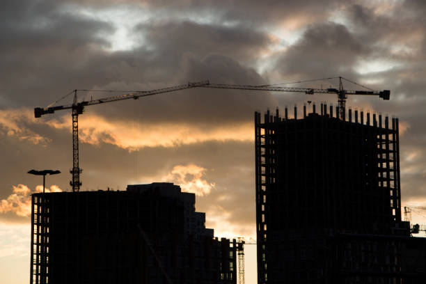istock tower crane against the blue sky, the process of building a multi-storey building 889981448