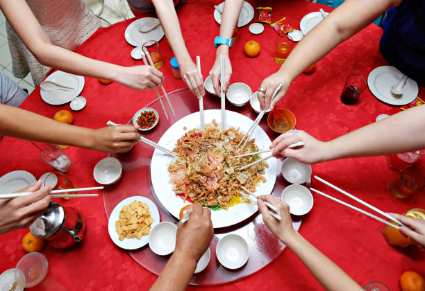 istock Yu Sheng Spring Toss also known by Yee Sang Chinese New Year Dish for Prosperity Toss Celebration 889981732
