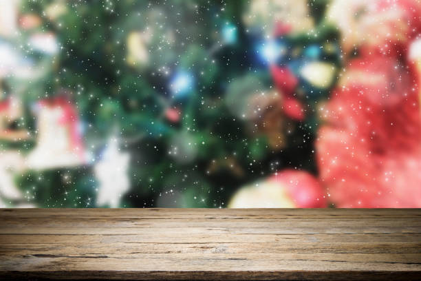 istock Wood table top on bokeh Christmas background. 889984026
