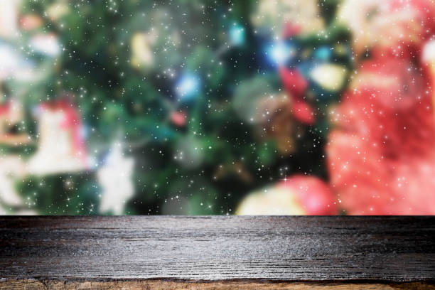 istock Wood table top on bokeh Christmas background. 889984028