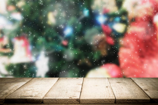 istock Wood table top on bokeh Christmas background. 889984030