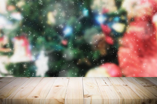 istock Wood table top on bokeh Christmas background. 889984038