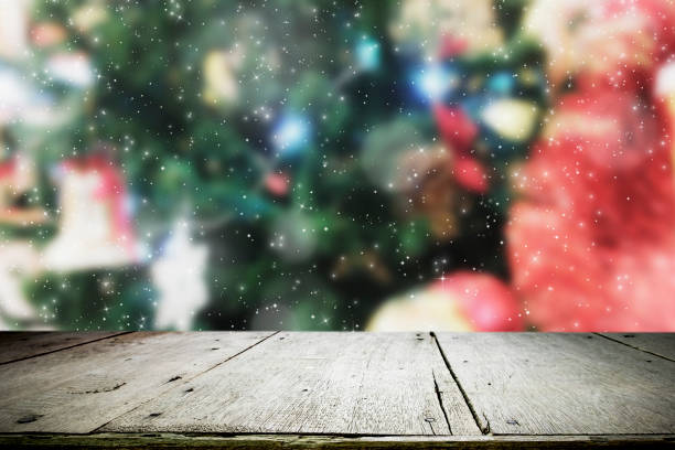 istock Wood table top on bokeh Christmas background. 889984042