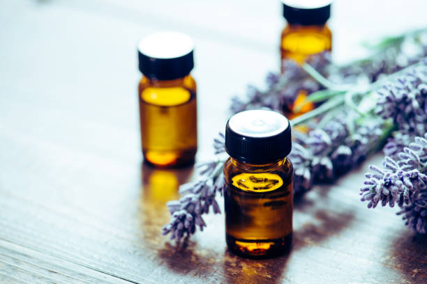 istock Aromatherapy tools, bottles with oil and lavender flowers 889984412