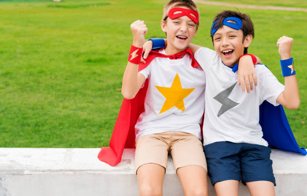 istock Friends playing superheroes together 889986688