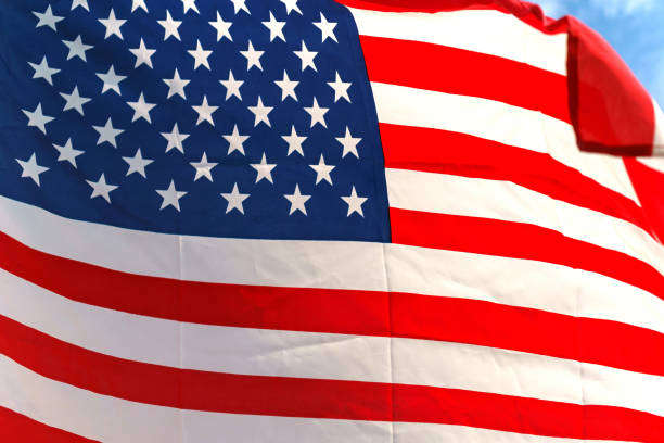 istock Waving star and stripes American flag 890001222