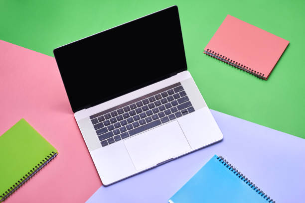 istock Laptop with blank screen on color background. View from above 890004480