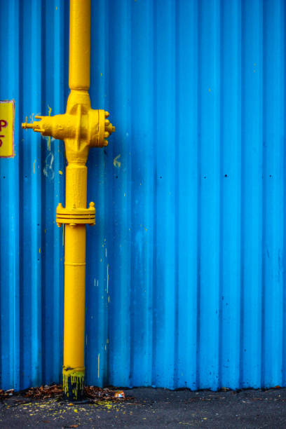 istock yellow gas track against the blue iron wall 890004544