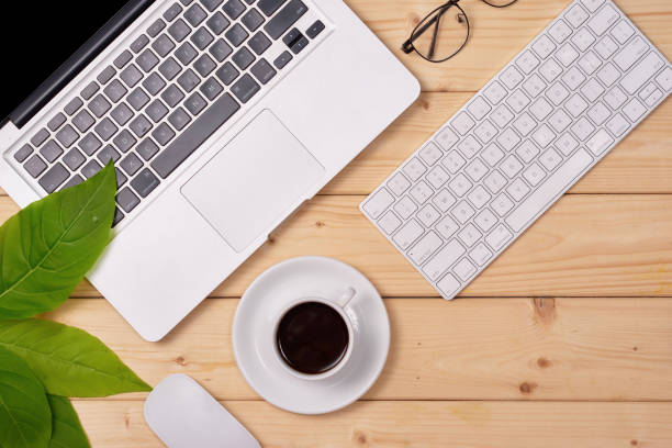 istock Office desk table with laptop computer and coffee. Top view with copy space 890028198