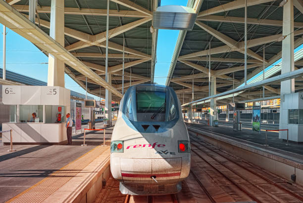 North Railways Station and modern hi-speed passenger train of Spanish railways company - Renfe. Valencia, Spain - June 13, 2017 : North Railways Station (Estacio del Nord) and modern hi-speed passenger train of Spanish railways company - Renfe. seville port stock pictures, royalty-free photos & images