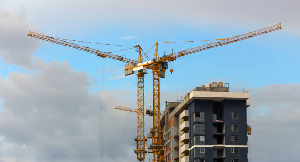 istock tower crane against the blue sky, the process of building a multi-storey building 890066066