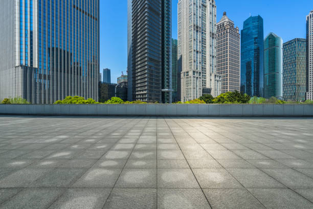 istock Empty brick floor with modern building in shanghai, china 890084386