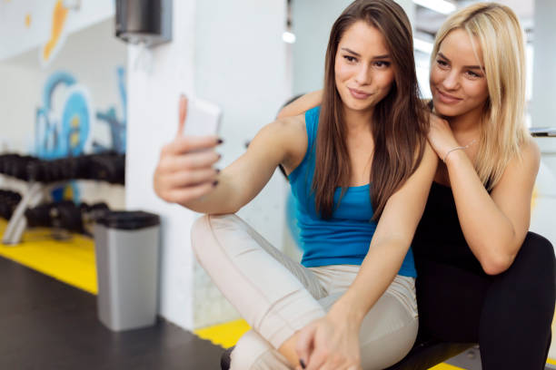 istock Beautiful  women taking selfies 890086752