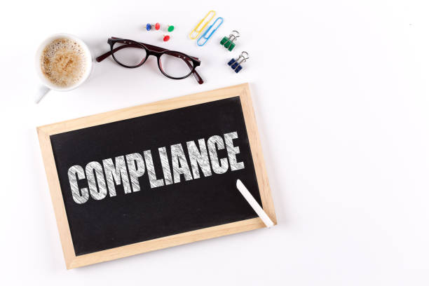 istock COMPLIANCE word on Chalkboard with Coffee Cup, view from above 890092256