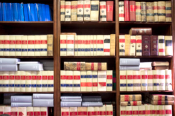 Bookshelf plenty of old legal books Bookshelf plenty of old legal books. Blurred background law library stock pictures, royalty-free photos & images