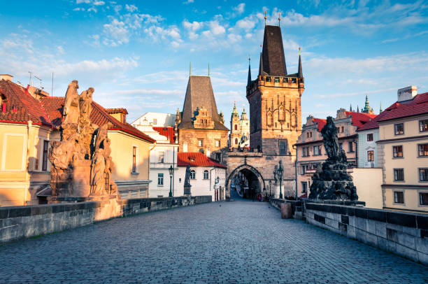 istock Sunny spring scene on Charles bridge on Vltava river (Karluv Most) with statues and Prague castle 890096648