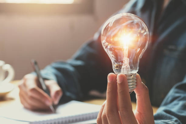 istock new idea and creative concept for business woman hand holding light bulb 890104574