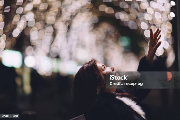 Woman Trying To Reach Light Stock Photo - Download Image Now - New Year, Hope - Concept, Reaching