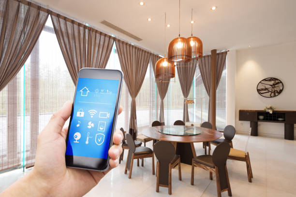 istock smart phone with smart home with modern dining room 890115540